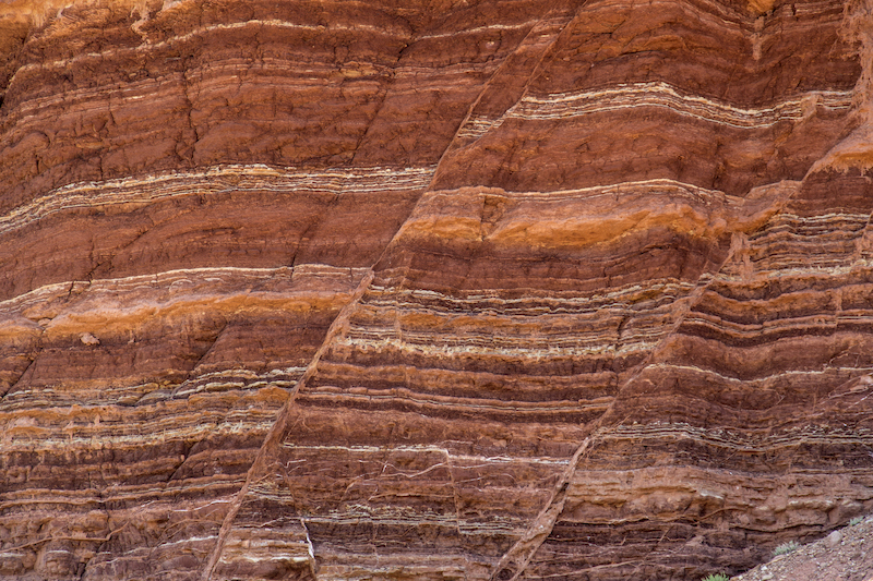 Fault lines and colorful layers in sandstone.